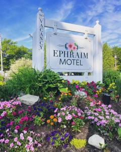 a sign for the epirriman motel with flowers at Ephraim Motel in Ephraim