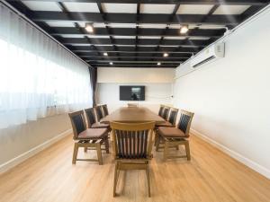 a conference room with a table and chairs in it at V1 boutique hotel in Kanchanaburi City