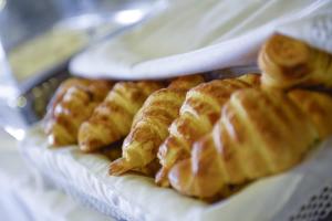 a bunch of waffles are lined up on a table at Hotel Apartamento Solverde in Espinho