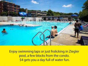 an outdoor swimming pool with people in the water at Stylish Flat in Walkable Downtown w Parking in Cincinnati