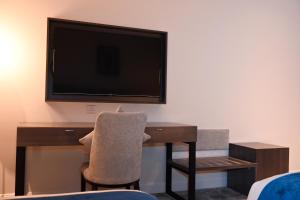TV o dispositivi per l'intrattenimento presso فندق سافوي جدة Savoye Hotel
