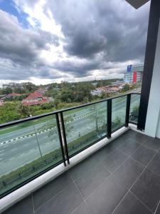 a balcony with a view of the water at Rex-apartment 3room near new Kpj Saradise Bdc in Kuching