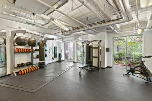 a fitness room with a gym with tread machines at Placemakr Dupont Circle in Washington, D.C.