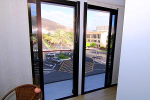 a sliding glass door with a view of a street at Chajofe 8 in Los Cristianos