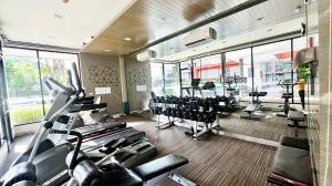 a gym with treadmills and cardio equipment in it at Phuket Kathu - Sunset View in Kathu