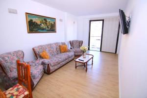a living room with a couch and a table at Chajofe 8 in Los Cristianos