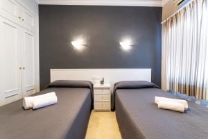 Postel nebo postele na pokoji v ubytování Hostal Ya