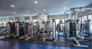 a gym with lots of tread machines and weights at Arcadia Beach Continental by Saowanee in Pattaya South
