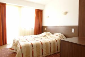 Postel nebo postele na pokoji v ubytování Aparthotel Winslow Highland