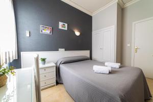 Postel nebo postele na pokoji v ubytování Hostal Ya