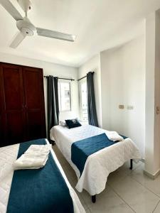 Postel nebo postele na pokoji v ubytování Loft en Montería, wifi, park, AA + 10 fotografií
