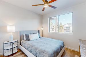 a bedroom with a bed and a ceiling fan at Mellow on Meadow Mile 2A in Fraser +32 photos