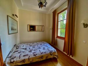 a bedroom with a bed and a window at Sopot Residence in Sopot