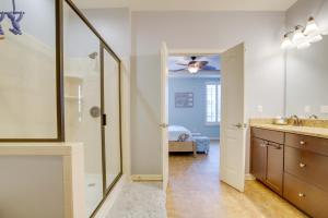 a bathroom with a shower and a sink and a mirror at Shuttle to Beach Millville Townhome with Porch in Millville +34 photos