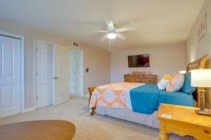 a bedroom with a bed and a ceiling fan at Shuttle to Beach Millville Townhome with Porch in Millville