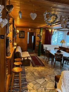 a living room with a table and a dining room at Patysiówka in Stronie Śląskie