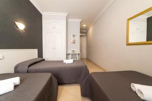 Postel nebo postele na pokoji v ubytování Hostal Ya