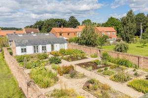 an aerial view of a garden in front of a house at The Garden House in Low Catton 