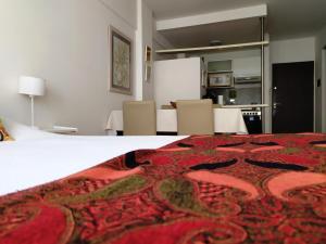 Кровать или кровати в номере Comodidad, óptima ubicación y tranquilidad en Nuñez