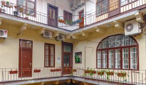 a courtyard of a building with balconies and windows at Main Square Studio Mare in Zagreb