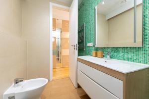 a bathroom with a sink and a mirror at LA CATOLICA GUEST HOUSE in Granada +25 photos