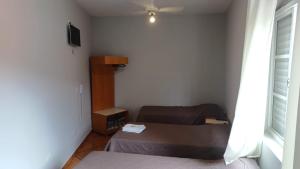 En eller flere senger på et rom på Victoria Hotel - Campanha - MG