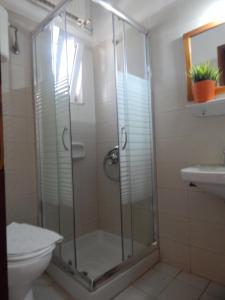 Koupelna v ubytování Posidonio Hotel