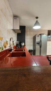 a kitchen with a sink and a refrigerator at casa campestre escobero in Envigado