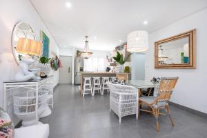 a kitchen and dining room with a table and chairs at Simbithi Verve in Ballito