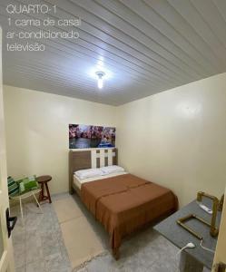 Postel nebo postele na pokoji v ubytování Aconchego de Maria