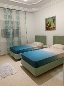 Postel nebo postele na pokoji v ubytování BENSASSI Urban Escape Premium