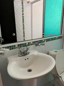 Koupelna v ubytování SGH Rodadero Suites