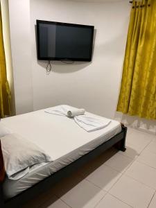 Postel nebo postele na pokoji v ubytování SGH Rodadero Suites