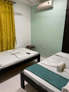 Postel nebo postele na pokoji v ubytování SGH Rodadero Suites