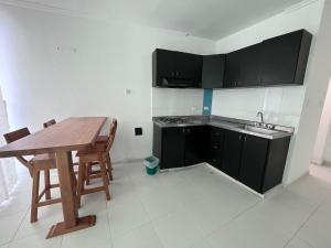 Kuchyň nebo kuchyňský kout v ubytování SGH Rodadero Suites