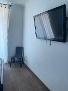 TV a/nebo společenská místnost v ubytování SGH Rodadero Suites