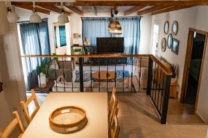 a room with a table and a living room at CASA MARES - Beach and Sun in Ensenada
