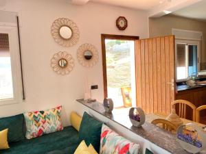 a living room with a couch and a table at Awechtam house in Aouchtame