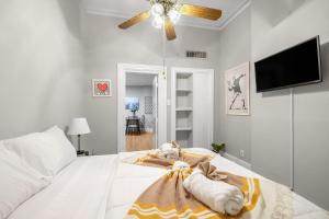 a bedroom with a bed with a stuffed animal on it at Modern Posh Upenndrexel Univ 3 Bdrm in Philadelphia