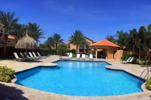 The swimming pool at or close to 3 minutes from best beaches in Aruba! Luxury Tropical Townhouse at Gold Coast Aruba