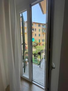 an open door with a view of a balcony at Le case di Cate e Max - Luna in Florence