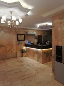 a large room with a lobby with a counter at فخامة المصيف للشقق المخدومة 2 in Taif