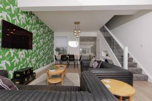 a living room with a couch and a table at 82 Van Road in Caerphilly