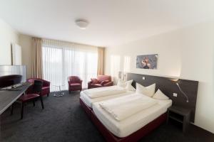 Postel nebo postele na pokoji v ubytování Hotel Bloemfontein
