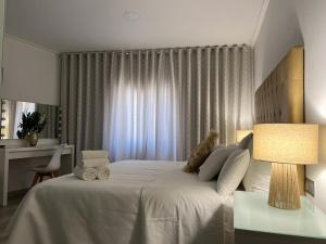 Postel nebo postele na pokoji v ubytování DON LEONE Hotel