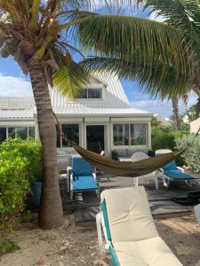 Posezení v ubytování Duplex luxe au NBBC , les pieds dans le sable