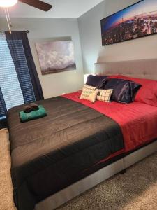 a bedroom with a large bed in a room at Blue Shark *B542* @ Medical Center Modern 1BR King Apartment in Houston