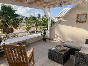 Posezení v ubytování Duplex luxe au NBBC , les pieds dans le sable