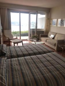 Ένα ή περισσότερα κρεβάτια σε δωμάτιο στο Bellevue- Bellavista