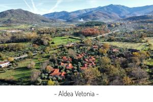 an aerial view of a village in the mountains at Aldea Vetonia Resort Familiar- PISCINAS-4 Zonas infantiles y deportivas 4 ACTIVIDADES AL DIA HASTA EL 8 DE SEPTIEMBRE CON MONITORES "SE ACEPTAN MASCOTAS DESDE EL 28 DE AGOSTO" in Hervás